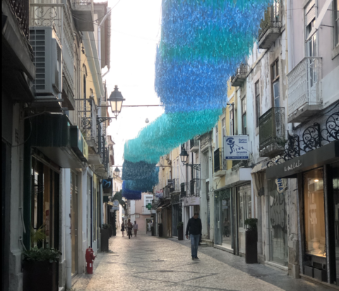 A small side street with buildings in an old Portuguese city center