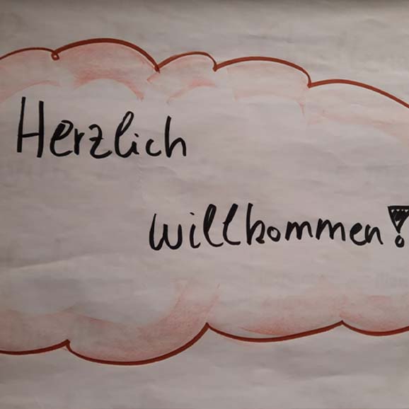 Herzlich Willkommen Nachricht auf Flipchart